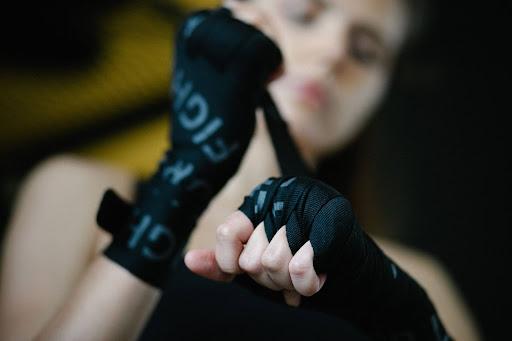 A woman wearing hand gloves