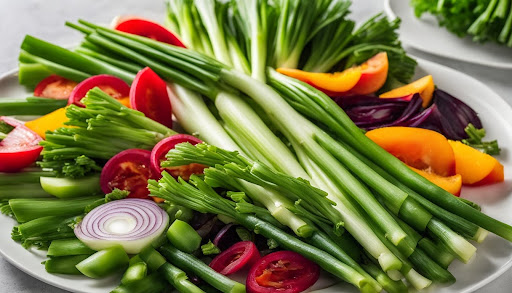 Una varietà di verdure diverse tra cui le foglie di cipolla verde